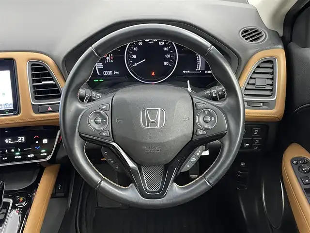ホンダ ヴェゼル ハイブリッド Z ホンダセンシング 千葉県 2020(令2)年 6.5万km スーパープラチナグレーメタリック ワンオーナー/ホンダセンシング/・アダプティブクルーズコントロール/・衝突被害軽減ブレーキ/・車線逸脱警報/・オートハイビーム/Gathersナビ/（CD/DVD/bluetooth/HDMI/USB/フルセグ）/バックカメラ/ハーフレザーシート/D/N席パワーシート/ビルトインETC/前後ドライブレコーダー/革巻きステアリング/パドルシフトイ/ステアリングスイッチ/純正フロアマット/ドアバイザー/純正17インチAW