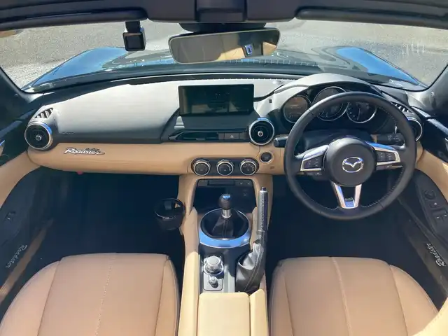 マツダ ロードスター S レザーパッケージ Vセレクション 静岡県 2024(令6)年 0.8万km ジェットブラックマイカ i-ACTIVESENSE/純正8.8インチディスプレイ/　AM FM　Bluetooth アレクサ スマホ連携/タンレザーシート/ベージュ幌/バックカメラ/ETC/ドライブレコーダー/LEDオートヘッドライト/レーダークルーズコントロール/6速MT/スマートキー×2本/純正16インチアルミホイール/社外マフラー/アシンメトリックLSD/ダイナミックスタビリティコントロールトラック/BOSEサウンド