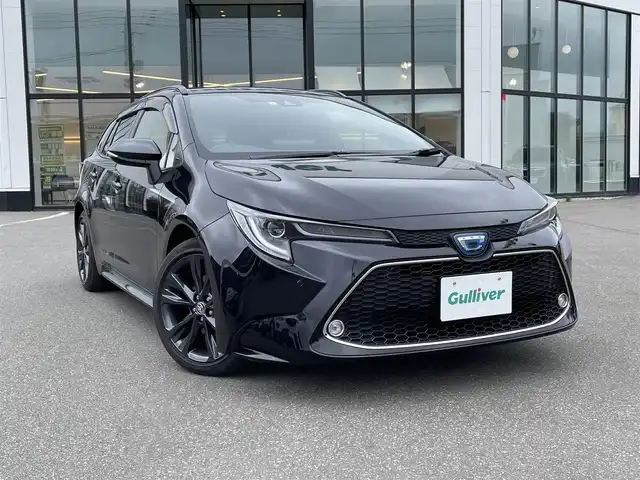 トヨタ カローラツーリング ハイブリッド ダブルバイビー 青森県 2021(令3)年 1.9万km スパークリングブラックパールクリスタルシャイン ・ワンオーナー/・４ＷＤ/・純正ＳＤナビ/　AM/FM/DVD/CD/USB/Bluetooth/・フルセグＴＶ/・バックカメラ/・ビルトインＥＴＣ/・セーフティセンス（予防安全パッケージ）/・プリクラッシュセーフティ/・レーントレーシングアシスト/・全車速追従機能付レーダークルーズコントロール/・オートマチックハイビーム/・ロードサインアシスト/・ドライブスタートコントロール/・車両接近通報装置/・フォグランプ/・ドアバイザー/・純正フロアマット/・１７インチ夏タイヤ純正アルミホイール装着/・スペアキー/・取扱説明書