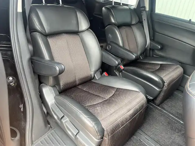 日産 エルグランド 250ハイウェイスターS 三重県 2015(平27)年 12.5万km ファントムブラック ワンオーナー/純正8インチナビMM514D-L/フリップダウンモニター/両側パアースライドドア/バックドアオートクロージャー/クルーズコントロール/LEDヘッドランプ/ハーフレザーシート/18インチアルミホイール