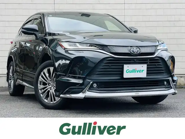 トヨタ ハリアー Z レザーパッケージ 大分県 2021(令3)年 1.9万km プレシャスブラックパール ワンオーナー /MODELLISTAエアロ：F/S/R/【MOP】プレシャスブラックパール〈219〉/【MOP】アクセサリーコンセントAC100V・100W（ラゲージ右側1個）/【MOP】ディスプレイオーディオ/（コネクティッドナビ対応）Plus/JBLプレミアムサウンドシステム/パノラミックビューモニター/デジタルインナーミラー(前後録画機能付)/ステアリングヒーター/Toyota Safety Sense/・プリクラッシュセーフティ/・レーントレーシングアシスト/・レーンディパーチャーアラート/・レーダークルーズコントロール/・アダプティブハイビームシステム/・ロードサインアシスト/・ドライバー異常時対応システム/・プロアクティブドライビングアシスト/・発進遅れ告知機能/ブラインドスポットモニター/安心降車アシスト＋後方車両への接近警報/パーキングサポートブレーキ/パワーバックドア/前席シートベンチレーション/前席シートヒーター/Z“Leather Package”専用19インチアルミ/LEDヘッドランプ/スマートキー2本/取扱説明書/保証書