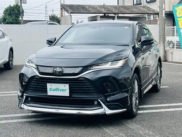 トヨタ ハリアー Z レザーパッケージ 大分県 2021(令3)年 1.9万km プレシャスブラックパール ワンオーナー /MODELLISTAエアロ：F/S/R/【MOP】プレシャスブラックパール〈219〉/【MOP】アクセサリーコンセントAC100V・100W（ラゲージ右側1個）/【MOP】ディスプレイオーディオ/（コネクティッドナビ対応）Plus/JBLプレミアムサウンドシステム/パノラミックビューモニター/デジタルインナーミラー(前後録画機能付)/ステアリングヒーター/Toyota Safety Sense/・プリクラッシュセーフティ/・レーントレーシングアシスト/・レーンディパーチャーアラート/・レーダークルーズコントロール/・アダプティブハイビームシステム/・ロードサインアシスト/・ドライバー異常時対応システム/・プロアクティブドライビングアシスト/・発進遅れ告知機能/ブラインドスポットモニター/安心降車アシスト＋後方車両への接近警報/パーキングサポートブレーキ/パワーバックドア/前席シートベンチレーション/前席シートヒーター/Z“Leather Package”専用19インチアルミ/LEDヘッドランプ/スマートキー2本/取扱説明書/保証書