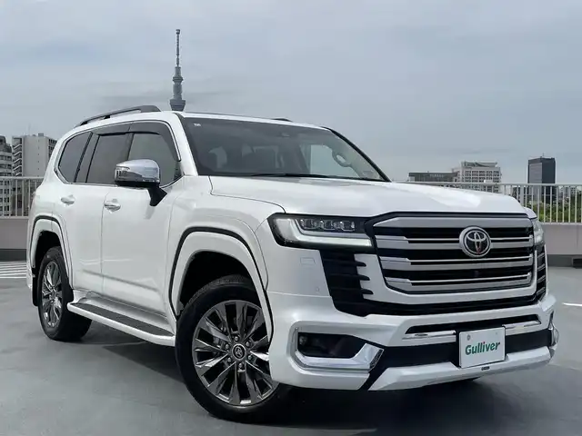 トヨタ ランドクルーザー ZX 東京都 2024(令6)年 0.2万km プレシャスホワイトパール ワンオーナー/４WD/12.3インチディスプレイナビ機能付き/【フルセグTV/Bluetooth/HDMI/USB/CD/DVD】/アランドビューモニター/リアエンターテーメントシステム/パワーバックドア/サンルーフ/ベージュ皮シート/モデリスタフェンダーガーニッシュ/モデリスタリアスカート/モデリスタフロントスポイラー/後席ディスプレイ/純正２０インチアルミ/クールBOX/Toyota Safety Sense/PCS(プリクラッシュセーフティー）/LTA(レーントレーシングアシスト）/AHS(アダプティブハイビームシステム）/RSA(ロードサインアシスト）/レーダークルーズコントロール/先行車発進お知らせ/スペアキー１本/保証書・取説・ナビ説