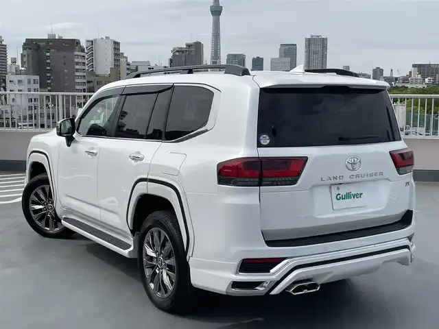 トヨタ ランドクルーザー ZX 東京都 2024(令6)年 0.2万km プレシャスホワイトパール ワンオーナー/４WD/12.3インチディスプレイナビ機能付き/【フルセグTV/Bluetooth/HDMI/USB/CD/DVD】/アランドビューモニター/リアエンターテーメントシステム/パワーバックドア/サンルーフ/ベージュ皮シート/モデリスタフェンダーガーニッシュ/モデリスタリアスカート/モデリスタフロントスポイラー/後席ディスプレイ/純正２０インチアルミ/クールBOX/Toyota Safety Sense/PCS(プリクラッシュセーフティー）/LTA(レーントレーシングアシスト）/AHS(アダプティブハイビームシステム）/RSA(ロードサインアシスト）/レーダークルーズコントロール/先行車発進お知らせ/スペアキー１本/保証書・取説・ナビ説