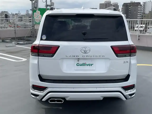 トヨタ ランドクルーザー ZX 東京都 2024(令6)年 0.2万km プレシャスホワイトパール ワンオーナー/４WD/12.3インチディスプレイナビ機能付き/【フルセグTV/Bluetooth/HDMI/USB/CD/DVD】/アランドビューモニター/リアエンターテーメントシステム/パワーバックドア/サンルーフ/ベージュ皮シート/モデリスタフェンダーガーニッシュ/モデリスタリアスカート/モデリスタフロントスポイラー/後席ディスプレイ/純正２０インチアルミ/クールBOX/Toyota Safety Sense/PCS(プリクラッシュセーフティー）/LTA(レーントレーシングアシスト）/AHS(アダプティブハイビームシステム）/RSA(ロードサインアシスト）/レーダークルーズコントロール/先行車発進お知らせ/スペアキー１本/保証書・取説・ナビ説