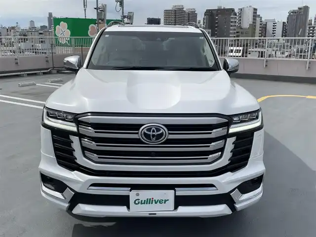 トヨタ ランドクルーザー ZX 東京都 2024(令6)年 0.2万km プレシャスホワイトパール ワンオーナー/４WD/12.3インチディスプレイナビ機能付き/【フルセグTV/Bluetooth/HDMI/USB/CD/DVD】/アランドビューモニター/リアエンターテーメントシステム/パワーバックドア/サンルーフ/ベージュ皮シート/モデリスタフェンダーガーニッシュ/モデリスタリアスカート/モデリスタフロントスポイラー/後席ディスプレイ/純正２０インチアルミ/クールBOX/Toyota Safety Sense/PCS(プリクラッシュセーフティー）/LTA(レーントレーシングアシスト）/AHS(アダプティブハイビームシステム）/RSA(ロードサインアシスト）/レーダークルーズコントロール/先行車発進お知らせ/スペアキー１本/保証書・取説・ナビ説
