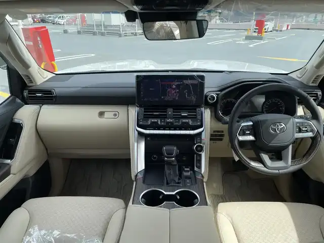 トヨタ ランドクルーザー ZX 東京都 2024(令6)年 0.2万km プレシャスホワイトパール ワンオーナー/４WD/12.3インチディスプレイナビ機能付き/【フルセグTV/Bluetooth/HDMI/USB/CD/DVD】/アランドビューモニター/リアエンターテーメントシステム/パワーバックドア/サンルーフ/ベージュ皮シート/モデリスタフェンダーガーニッシュ/モデリスタリアスカート/モデリスタフロントスポイラー/後席ディスプレイ/純正２０インチアルミ/クールBOX/Toyota Safety Sense/PCS(プリクラッシュセーフティー）/LTA(レーントレーシングアシスト）/AHS(アダプティブハイビームシステム）/RSA(ロードサインアシスト）/レーダークルーズコントロール/先行車発進お知らせ/スペアキー１本/保証書・取説・ナビ説