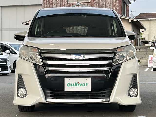 トヨタ ノア ハイブリッド Si 愛媛県 2016(平28)年 5.5万km ホワイトパールクリスタルシャイン ワンオーナー/社外メモリナビ/（CD/DVD/SD/BT/USB）/フルセグTV/バックカメラ/フリップダウンモニター/衝突軽減ブレーキ/両側パワースライドドア/スマートキー/プッシュスタート/スペアキー/アイドリングストップ/後席ロールサンシェード/保証書/取扱説明書