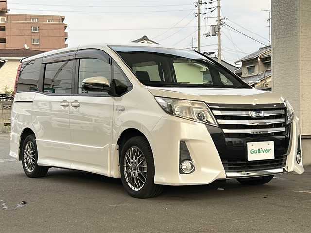 トヨタ ノア ハイブリッド Si 愛媛県 2016(平28)年 5.5万km ホワイトパールクリスタルシャイン ワンオーナー/社外メモリナビ/（CD/DVD/SD/BT/USB）/フルセグTV/バックカメラ/フリップダウンモニター/衝突軽減ブレーキ/両側パワースライドドア/スマートキー/プッシュスタート/スペアキー/アイドリングストップ/後席ロールサンシェード/保証書/取扱説明書