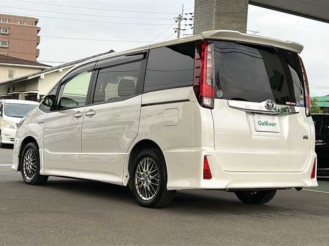 トヨタ ノア ハイブリッド Si 愛媛県 2016(平28)年 5.5万km ホワイトパールクリスタルシャイン ワンオーナー/社外メモリナビ/（CD/DVD/SD/BT/USB）/フルセグTV/バックカメラ/フリップダウンモニター/衝突軽減ブレーキ/両側パワースライドドア/スマートキー/プッシュスタート/スペアキー/アイドリングストップ/後席ロールサンシェード/保証書/取扱説明書