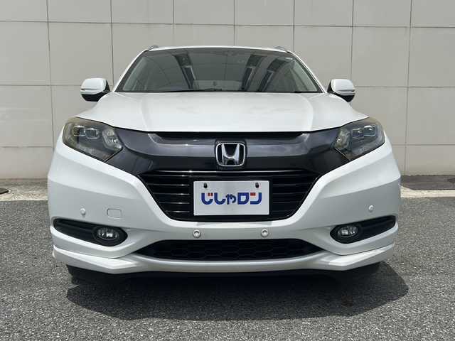 ホンダ ヴェゼル ハイブリッド Z 埼玉県 2015(平27)年 13.8万km ホワイトオーキッドパール (株)IDOMが運営する【じしゃロン熊谷店】の自社ローン専用車両になりますこちらは現金またはオートローンご利用時の価格です。自社ローンご希望の方は別途その旨お申付け下さい/純正HDDナビ（BT/フルセグTV/AM/FM/CD/DVD)/ETC/社外ドライブレコーダー/バックカメラ/クルーズコントロール/LEDヘッドライト/コーナーセンサー/スペアキー/ルーフレール/シートヒーター/純正アルミホイール/プッシュスタート/純正フロアマット/ECON