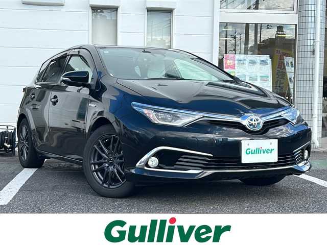 トヨタ オーリスハイブリッド Gパッケージ 愛知県 2016(平28)年 9.7万km ブラックマイカ /純正ナビ/フルセグTV//Bluetooth/CD・DVD//バックカメラ/ビルトインETC//社外デジタルインナーミラー//トヨタセーフティセンスC//プリクラッシュセーフティ//レーンディパーチャーアラート//クリアランスソナー//クルーズコントロール//先行車発進お知らせ//専用本革×ウルトラスエードシート//前席シートヒーター//LEDオートライト//電動格納ミラーウィンカー//プッシュスタート//ISOFIX//純正フロアマット/純正ドアバイザー//取扱説明書/新車保証書//スペアキー//車検R9年５月２３日まで