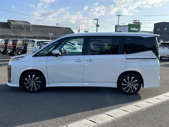 トヨタ ヴォクシー ハイブリッド S－Z 山形県 2025(令7)年 0.1万km未満 ホワイトパールクリスタルシャイン 純正HDDナビ/(フルセグTV/Bluetooth/USB/HDMI)/フリップダウンモニター/両側パワースライドドア/クルーズコントロール/バックカメラ/ETC2.0/シートヒーター/ハンドルヒーター/純正LEDライト/純正アルミホイール/ハーフレザーシート