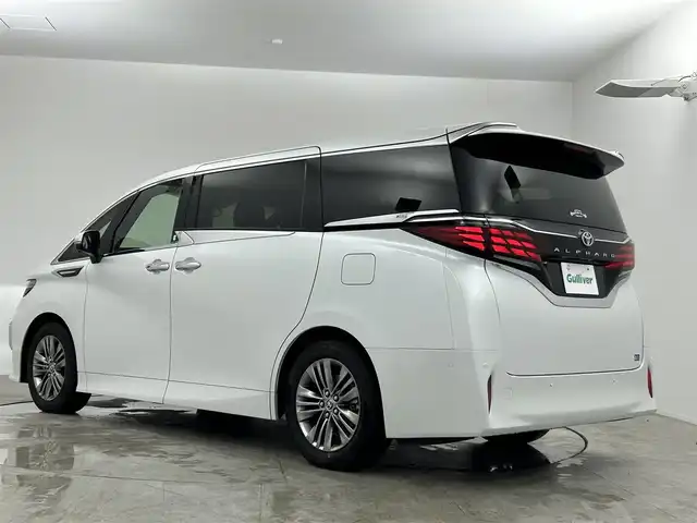 トヨタ アルファード Z 愛知県 2024(令6)年 1.8万km プラチナホワイトパールマイカ 純正14型ナビ（フルセグ、Bluetooth、HDMI、AppleCarplay)/13型有機ELフリップダウンモニター/トヨタチームメイト/左右独立サンルーフ/全方位カメラ/デジタルインナーミラー/BSM/HUD/ACC/置くだけ充電器/パーキングアシスト/両側パワスラドア/ETC2.0/360度ドライブレコーダー/パワーバックドア/パワーシート（D+N)/1・2列目シートヒーター、エアシート/衝突軽減ブレーキ/レーンキープアシスト/電子パーキング/オートホールド/USB/コーナーセンサー/LEDヘッドライト/オートハイビーム/オートライト/社外フロアマット/純正18インチAW/スマートキー/横滑り防止装置/三点エアバック