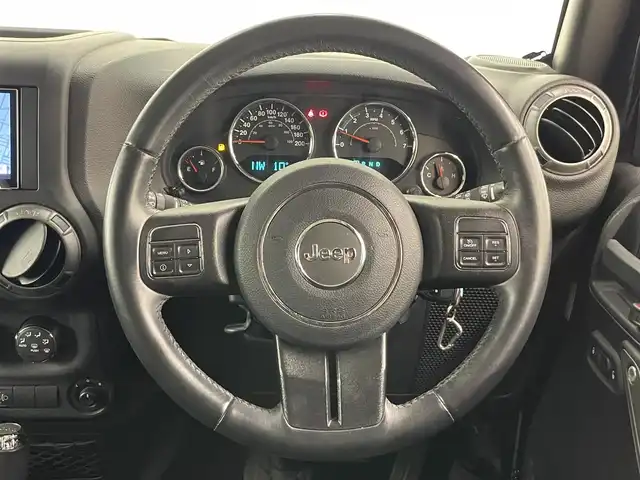 クライスラー・ジープ ジープ ラングラー アンリミテッド スポーツ 岡山県 2017(平29)年 7.1万km ブラック 社外メモリナビ（ＣＤ/ラジオ/ＢＴ/フルセグ）/バックカメラ/ＥＴＣ/ドライブレコーダー/クルーズコントロール/ステアリングスイッチ/横滑り防止装置/リモコンキー×２/純正18インチＡＷ/ドアバイザー/純正ゴムマット