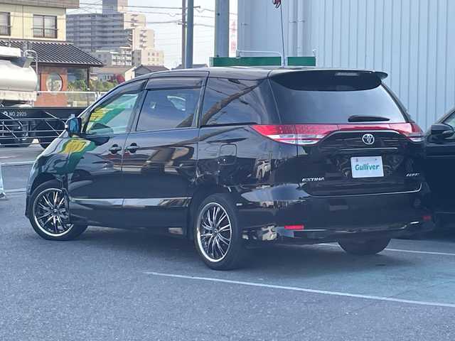 トヨタ エスティマ アエラス 愛知県 2006(平18)年 11万km ブラック /革巻きステア/ステアスイッチ/パワスラ/純正フロアマット/純正ドアバイザー/照明付きバニティミラー/HIDオートライト/フォグ/ETC/プッシュスタート/スマートキー