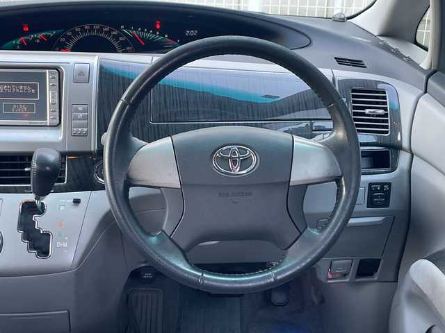 トヨタ エスティマ アエラス 愛知県 2006(平18)年 11万km ブラック /革巻きステア/ステアスイッチ/パワスラ/純正フロアマット/純正ドアバイザー/照明付きバニティミラー/HIDオートライト/フォグ/ETC/プッシュスタート/スマートキー