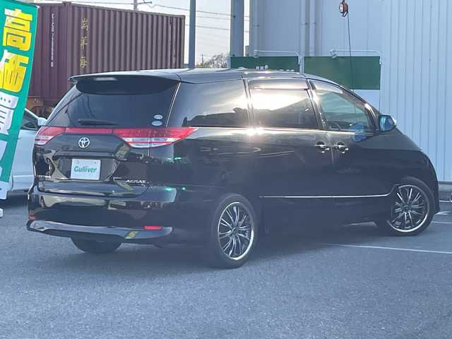 トヨタ エスティマ アエラス 愛知県 2006(平18)年 11万km ブラック /革巻きステア/ステアスイッチ/パワスラ/純正フロアマット/純正ドアバイザー/照明付きバニティミラー/HIDオートライト/フォグ/ETC/プッシュスタート/スマートキー