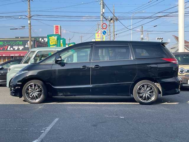 トヨタ エスティマ アエラス 愛知県 2006(平18)年 11万km ブラック /革巻きステア/ステアスイッチ/パワスラ/純正フロアマット/純正ドアバイザー/照明付きバニティミラー/HIDオートライト/フォグ/ETC/プッシュスタート/スマートキー