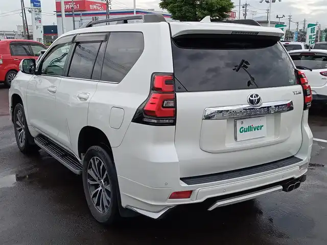 トヨタ ランドクルーザー プラド TZ－G 福井県 2018(平30)年 3.5万km ホワイトパールクリスタルシャイン 衝突被害軽減システム/メーカーOPナビ（B9129）/・（フルセグTV/CD/DVD/Bluetooth）/アラウンドビューモニター/ビルトインETC2.0/モデリスタエアロ/ステアリングスイッチ/シートヒーター・クーラー/前席パワーシート/オートLEDライト/電動格納ウィンカーミラー/純正19インチAW/純正フロアマット/スマートキー
