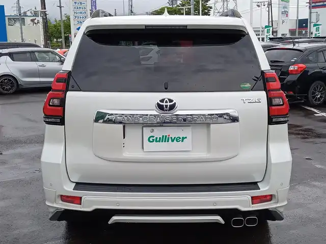 トヨタ ランドクルーザー プラド TZ－G 福井県 2018(平30)年 3.5万km ホワイトパールクリスタルシャイン 衝突被害軽減システム/メーカーOPナビ（B9129）/・（フルセグTV/CD/DVD/Bluetooth）/アラウンドビューモニター/ビルトインETC2.0/モデリスタエアロ/ステアリングスイッチ/シートヒーター・クーラー/前席パワーシート/オートLEDライト/電動格納ウィンカーミラー/純正19インチAW/純正フロアマット/スマートキー
