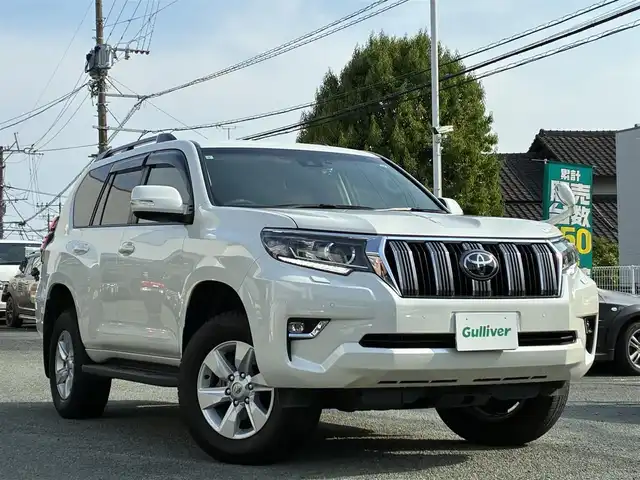 トヨタ ランドクルーザー プラド TX 熊本県 2021(令3)年 2.3万km ホワイトパールクリスタルシャイン ワンオーナー/4WD/純正SDナビ（NSZT-Y68T）/【フルセグTV/SD/CD/DVD/Bluetooth/USB】/衝突被害軽減システム/レーダークルーズコントロール/パーキングサポートブレーキ/レーンキープアシスト/車両接近通報装置/コーナーセンサー/オートLEDライト/オートマチックハイビーム/ビルトインETC/ドライブレコーダー(ZDR-015)/横滑り防止装置/盗難防止装置/純正フロアマット/カーテンエアバッグ/三列シート/プッシュスタート/スマートキー/スペアキー/取扱説明書/保証書