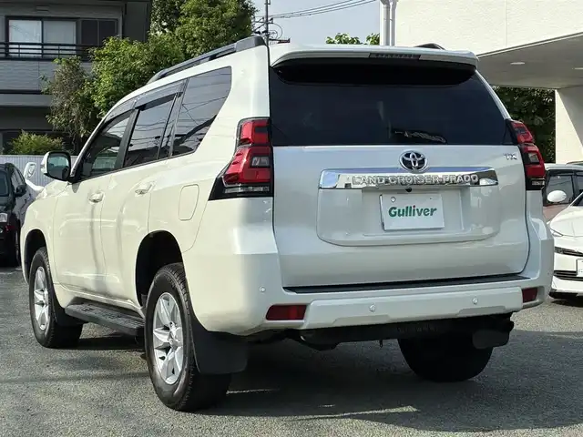 トヨタ ランドクルーザー プラド TX 熊本県 2021(令3)年 2.3万km ホワイトパールクリスタルシャイン ワンオーナー/4WD/純正SDナビ（NSZT-Y68T）/【フルセグTV/SD/CD/DVD/Bluetooth/USB】/衝突被害軽減システム/レーダークルーズコントロール/パーキングサポートブレーキ/レーンキープアシスト/車両接近通報装置/コーナーセンサー/オートLEDライト/オートマチックハイビーム/ビルトインETC/ドライブレコーダー(ZDR-015)/横滑り防止装置/盗難防止装置/純正フロアマット/カーテンエアバッグ/三列シート/プッシュスタート/スマートキー/スペアキー/取扱説明書/保証書