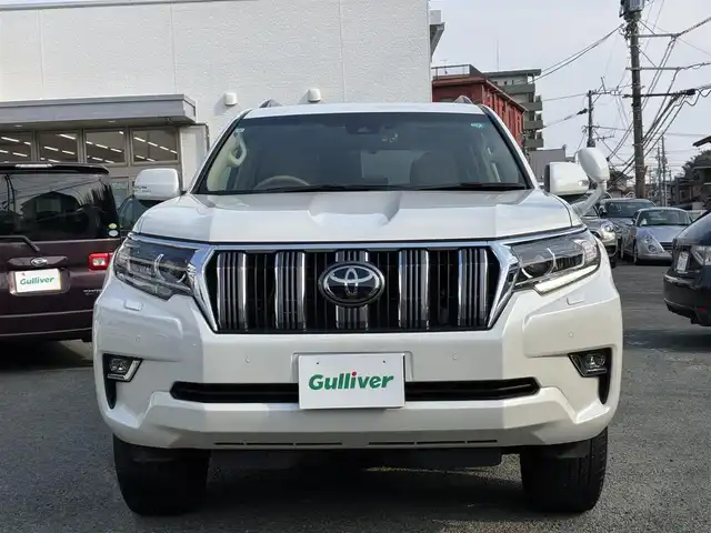 トヨタ ランドクルーザー プラド TX 熊本県 2021(令3)年 2.3万km ホワイトパールクリスタルシャイン ワンオーナー/4WD/純正SDナビ（NSZT-Y68T）/【フルセグTV/SD/CD/DVD/Bluetooth/USB】/衝突被害軽減システム/レーダークルーズコントロール/パーキングサポートブレーキ/レーンキープアシスト/車両接近通報装置/コーナーセンサー/オートLEDライト/オートマチックハイビーム/ビルトインETC/ドライブレコーダー(ZDR-015)/横滑り防止装置/盗難防止装置/純正フロアマット/カーテンエアバッグ/三列シート/プッシュスタート/スマートキー/スペアキー/取扱説明書/保証書