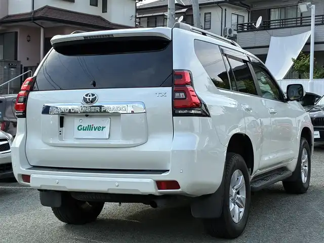 トヨタ ランドクルーザー プラド TX 熊本県 2021(令3)年 2.3万km ホワイトパールクリスタルシャイン ワンオーナー/4WD/純正SDナビ（NSZT-Y68T）/【フルセグTV/SD/CD/DVD/Bluetooth/USB】/衝突被害軽減システム/レーダークルーズコントロール/パーキングサポートブレーキ/レーンキープアシスト/車両接近通報装置/コーナーセンサー/オートLEDライト/オートマチックハイビーム/ビルトインETC/ドライブレコーダー(ZDR-015)/横滑り防止装置/盗難防止装置/純正フロアマット/カーテンエアバッグ/三列シート/プッシュスタート/スマートキー/スペアキー/取扱説明書/保証書