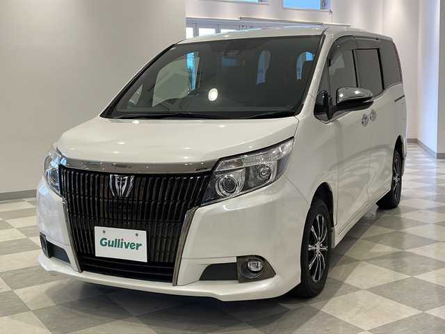 トヨタ エスクァイア Gi ブラックテーラード 福井県 2016(平28)年 13.1万km ホワイトパールクリスタルシャイン ４WD/ワンオーナー/アルパイン11インチメモリーナビ（EX11V）/フルセグTV/BT/CD/DVD/SD/USB/AUX/バックカメラ/10インチフリップダウンモニター（RSA10S-L-S)/セーフティセンス/・プリクラッシュセーフティ/・レーンディパーチャーアラート/・オートマチックハイビーム/・先行車発進警告機能/クルーズコントロール/ETC/パワースライドドア/レザーシート/シートヒーター/オートライト/LEDヘッドライト/社外アルミホイール/MTモード付AT/純正フロアマット/ステアリングスイッチ
