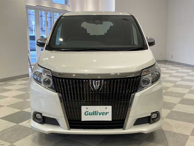 トヨタ エスクァイア Gi ブラックテーラード 福井県 2016(平28)年 13.1万km ホワイトパールクリスタルシャイン ４WD/ワンオーナー/アルパイン11インチメモリーナビ（EX11V）/フルセグTV/BT/CD/DVD/SD/USB/AUX/バックカメラ/10インチフリップダウンモニター（RSA10S-L-S)/セーフティセンス/・プリクラッシュセーフティ/・レーンディパーチャーアラート/・オートマチックハイビーム/・先行車発進警告機能/クルーズコントロール/ETC/パワースライドドア/レザーシート/シートヒーター/オートライト/LEDヘッドライト/社外アルミホイール/MTモード付AT/純正フロアマット/ステアリングスイッチ