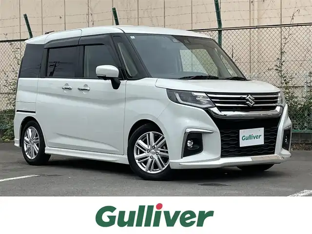 スズキ ソリオ HV MZ 東京都 2024(令6)年 1.6万km ピュアホワイトP アラウンドビューモニター　/両側電動スライドドア　/ヘッドアップディスプレイ　/純正８型ナビ　/・ＨＤＭＩ　/・Ｂｌｕｅｔｏｏｔｈ　/・フルセグ　/オートクルーズ　/レーンキープアシスト　/クリアランスソナー