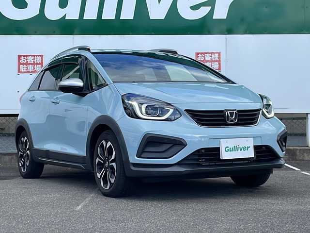 ホンダ フィット クロスター 福島県 2022(令4)年 2.7万km サーフブルー 衝突軽減ブレーキ/純正SDナビ/（FM/AM/Bluetooth/USB）/フルセグTV/バックカメラ/ETC/LEDヘッドライト/アイドリングストップ/横滑り防止装置/プッシュスタート/スペアキー/スマートキー/純正フロアマット/取扱説明書