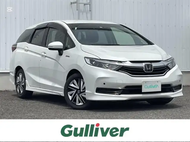 ホンダ シャトル ハイブリッド ホンダセンシング 熊本県 2019(令1)年 5.6万km プラチナホワイトパール 社外ナビ/・AM/FM/CD/DVD/SD/USB/iPod/AUX/BT/バックカメラ/ホンダセンシング/・衝突軽減ブレーキ/・アダプティブクルーズコントロール/・車線維持支援システム/・先行車発進お知らせ機能/・路外逸脱抑制機能/・標識認識機能/前後コーナーセンサー/ETC/電動格納ミラー/・ウィンカーミラー/ヘッドライトレベライザー/ステアリングリモコン/スポーツモード/プッシュスタート/スマートキー×2