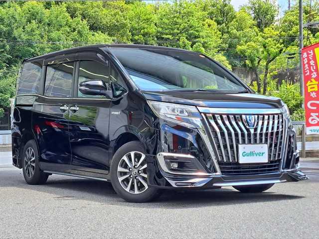 トヨタ エスクァイア ハイブリッド Gi 大阪府 2018(平30)年 11.3万km ブラック /禁煙車//ワンオーナー//純正10型SDナビ【NZN-Z66T】//フルTV/CD/DVD/Bluetooth/SD//バックカメラ//前席シートヒーター//両側パワースライドドア//レザーシート//衝突軽減ブレーキ//オートハイビーム//レーンキープアシスト//ビルトインETC2.0//クルーズコントロール//コーナーセンサー