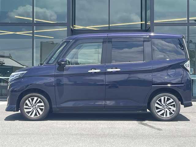 トヨタ ルーミー カスタムG 愛媛県 2022(令4)年 2.7万km クールバイオレットクリスタルシャイン 純正9インチディスプレイオーディオ　/AppleCarPlay/BT/フルセグ/バックカメラ/両側電動スライド　　/トヨタセーフティセンス/レーダークルーズコントロール　　/衝突被害軽減装置/車線逸脱防止装置/前後コーナーセンサー/電動パーキングブレーキ/AutoHold/ドライブレコーダー　/LEDへッドライト　/アイドリングストップ/純正ドアバイザー/電格ミラー/シガーソケット/ISOFIX/現状サマー(純正AW)(165/65/R14)/GOODYEAR effecientgrip