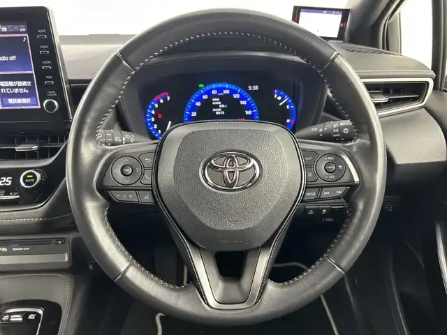 トヨタ カローラツーリング ハイブリッド ダブルバイビー 愛知県 2021(令3)年 2.4万km ホワイトパールクリスタルシャイン 禁煙車/純正9インチナビ/（CD/DVD/Bluetooth/フルセグTV/USB/AM/FM)/バックカメラ/AC100V電源/トヨタセーフティセンス/・プリクラッシュセーフティ/・レーントレーシングアシスト/・パーキングセンサー/・パーキングサポートブレーキ/・ロードサインアシスト/・レーダークルーズコントロール/・オートマチックハイビーム/ETC/前後ドライブレコーダー/シートヒーター/ハーフレザーシート/ステアリングヒーター/純正17インチアルミホイール/スマートキー/プッシュスタート/LEDヘッドライト/フロントフォグランプ/オートライト/純正フロアマット/電子パーキングブレーキ/オートホールド/横滑り防止装置/電動格納ミラー