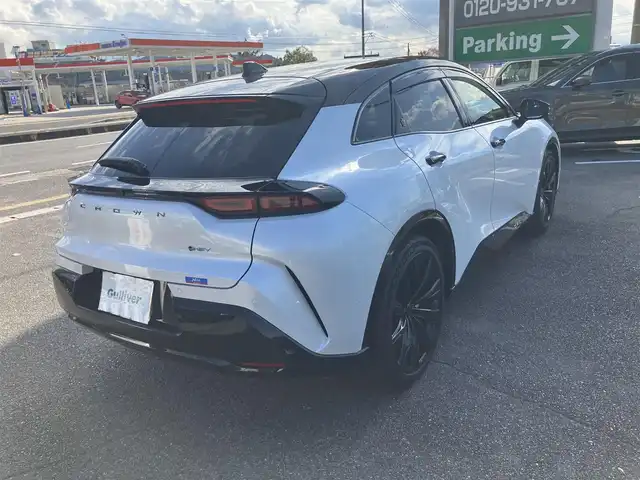 トヨタ クラウン スポーツ Z 広島県 2024(令6)年 1.4万km パールⅡ セーフティセンス/トヨタチームメイト/バイトーン/パノラマルーフ（電動シェード）/純正ナビ/パノラミックビューモニター/フルセグTV・Bluetooth/パーキングサポートブレーキ/ブラインドスポットモニタリング/デジタルインナーミラー/ステアリングヒーター/ドライバーモニターカメラ/ヘッドアップディスプレイ/ブラックレザーシート/ベンチレーション付きシートヒーター/パワーシート/ハンズフリーパワーバックドア/プレミアムサウンドシステム/ビルトインETC2.0/置くだけ充電/レーダークルーズ/タイプC端子/LEDオートライト/新車保証書/スペアキー