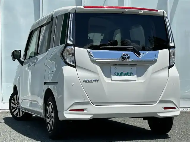 トヨタ ルーミー カスタムG 福岡県 2021(令3)年 2.5万km パールホワイトⅢ ・純正9インチディスプレイオーディオ/（ラジオ/フルセグ/Bluetooth/USB/iPod/交通情報）/・両側パワースライドドア/・アラウンドビューモニター/・ビルドインETC/・衝突被害軽減システム/・クリアランスソナー/・横滑り防止装置/・LEDヘッドライト/・追従型クルーズコントロール/・電動パーキングブレーキ/・ステアリングスイッチ/・オート電動格納ミラー/・D/N席シートヒーター/・ドアバイザー/・リアテーブル/・ISOFIX
