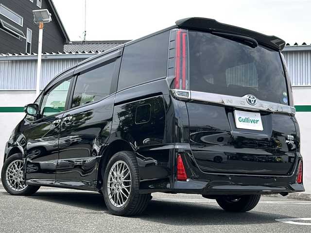 トヨタ ノア ハイブリッド Si ダブルバイビーⅡ 東京都 2020(令2)年 3.1万km ブラック ワンオーナー/Toyota Safety Sense/・PCS(プリクラッシュセーフティー)/・LDA(レーンディパーチャアラー)/・オートマチックハイビーム/・先行車発進告知機能/クルーズコントロール/クリアランスソナー/TOYOTA純正１０インチナビ/【フルセグ・Bluetooth】/フリップダウンモニター/バックカメラ/前方ドライブレコーダー/両側パワースライドドア/シートヒーター（運転席・助手席）/純正16インチアルミ/純正フロアマット/スマートキー/スペアキー/保証書/取説