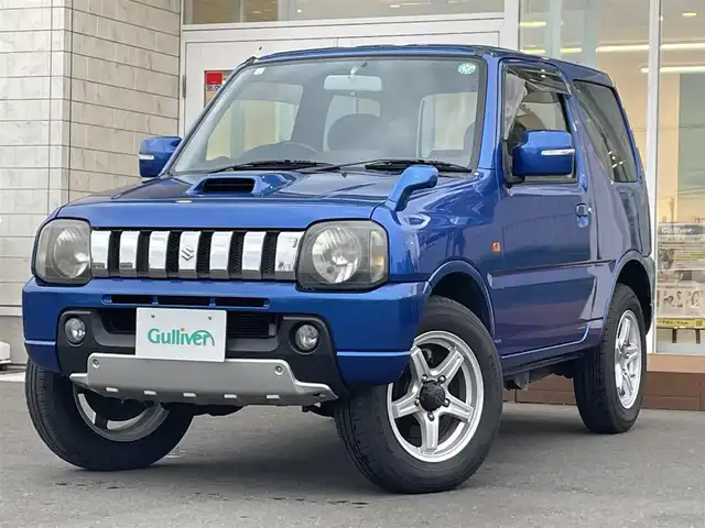 スズキ ジムニー クロスアドベンチャー XC 道央・札幌 2012(平24)年 5万km パールメタリックカシミールブルー ・４WD/・社外ナビ/　CD＆BT＆TV/・シートヒーター/・ミラーヒーター/・電動格納ミラー/・純正フロアマット/・背面タイヤ/・ウィンカーミラー/・フォグライト/・リモコンキー