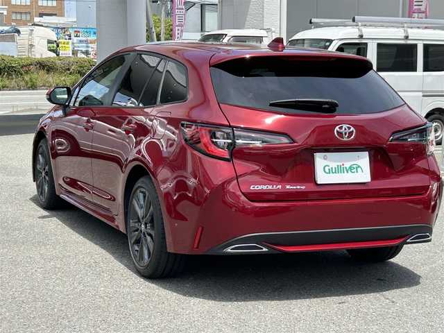 トヨタ カローラツーリング ダブルバイビー 福岡県 2022(令4)年 1.4万km センシュアルレッドマイカ ワンオーナー/禁煙車/純正ナビ（AM/FM/BT）/レーダークルーズコントロール/前席シートヒーター/ステアリングヒーター/バックカメラ/クリアランスソナー/ビルトインETC/LEDライト/オートハイビーム/フォグライト/ウインカーミラー/プッシュスタート/スマートキー/スペア×１/横滑り防止装置/レーンキープアシスト/純正フロアマット/純正１７インチアルミホイール/保証書/取扱説明書