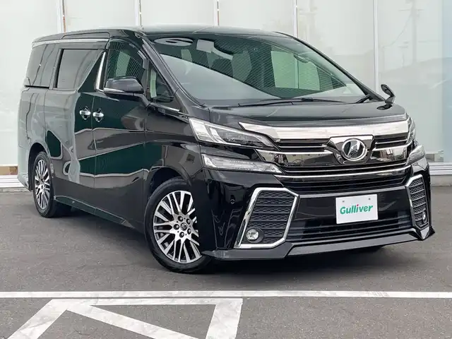 トヨタ ヴェルファイア Z Gエディション 神奈川県 2015(平27)年 9.7万km ブラック 純正９型ＳＤナビ（NSZT-Y64T）/Bluetooth/CD/DVD/USB/パワースライドドア/クルーズコントロール/バックカメラ/ドライブレコーダー/純正フリップダウン（V11T-R62C）/パワーシート/オットマン/ステアリングヒーター/オートブレーキホールド/コーナーセンサー/ＬＥＤヘッドライト/フロントフォグランプ/オートライト/純正アルミホイール/純正フロアマット/横滑り防止装置/カーテンエアバック