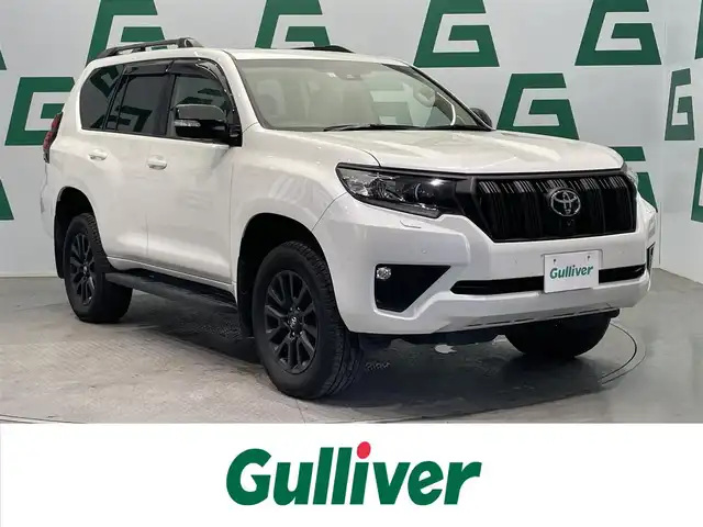 トヨタ ランドクルーザー プラド TX Lパッケージ マットブラED 鹿児島県 2023(令5)年 2.2万km ホワイトパールクリスタルシャイン 禁煙車/４WD/トヨタセーフティセンス/　・プリクラッシュセーフティ/　・レーンディバーチャーアラート/　・オートマチックハイビーム/　・レーダークルーズコントロール/サンルーフ/シートベンチレーション/前後コーナーセンサー/電動格納サードシート/ナビ機能付きディスプレイオーディオ/　・Bluetooth/　・USB/　・AppleCarPlay/　・AndroidAuto/ETC2.0/ドライブレコーダー/純正フロアマット/純正ドアバイザー/全席オートパワーウィンドウ/ステアリングリモコン/電動格納ミラー