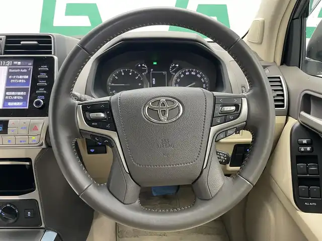 トヨタ ランドクルーザー プラド TX Lパッケージ マットブラED 鹿児島県 2023(令5)年 2.2万km ホワイトパールクリスタルシャイン 禁煙車/４WD/トヨタセーフティセンス/　・プリクラッシュセーフティ/　・レーンディバーチャーアラート/　・オートマチックハイビーム/　・レーダークルーズコントロール/サンルーフ/シートベンチレーション/前後コーナーセンサー/電動格納サードシート/ナビ機能付きディスプレイオーディオ/　・Bluetooth/　・USB/　・AppleCarPlay/　・AndroidAuto/ETC2.0/ドライブレコーダー/純正フロアマット/純正ドアバイザー/全席オートパワーウィンドウ/ステアリングリモコン/電動格納ミラー