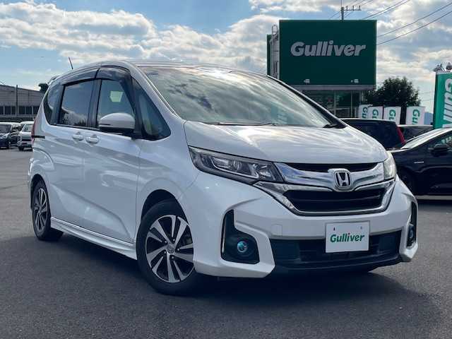 ホンダ フリード G ホンダセンシング 静岡県 2017(平29)年 7万km ホワイトオーキッドパール ●純正ナビ/(ワンセグ/CD/DVD/Bluetooth)/(ギャザズ/VXM-175VFi)/●ハーフレザーシート/●バックカメラ/●アダプティブクルーズコントロール/●衝突被害軽減システム/●レーンキープアシスト/●ワイパーデアイサー/●フォグランプ/●オートライト/●革巻きステアリング/●ステアリングスイッチ/●ETC/●両側パワースライドドア/●電動格納ウィンカーミラー/●ドアバイザー/●スマートキー/●プッシュスタート/●純正15インチアルミホイール/●ダブル+サイド+カーテンSRS+ABS/●保証書/●取扱説明書