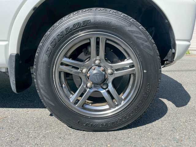 スズキ ジムニー クロスアドベンチャー 岩手県 2014(平26)年 7.7万km パールホワイト 社外メモリーナビ/（フルセグTV/CD/DVDBluetooth）/シートヒーター/ETC/パートタイム４WD/純正16インチナビ/フォグライト/ターボ/ドアバイザー