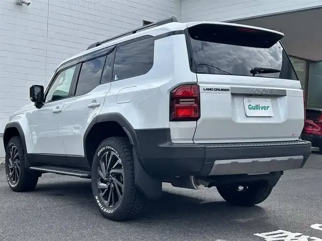 トヨタ ランドクルーザー ２５０ VX 長崎県 2024(令6)年 0.3万km プラチナホワイトパールマイカ ワンオーナー/純正ディスプレイオーディオ/(FM/AM/BT/フルセグTV/Miracast/ナビ)/プッシュスタート/MTモード付AT/フルタイム4WD/ビルトインETC/全方位カメラ/サンルーフ/ルーフレール/レーダークルーズコントロール/ドライブレコーダー内蔵型デジタルインナーミラー/純正フロアマット/モデリスタR20アルミホイール/ステアリングヒーター/レザーシート/D席パワーシート/DN席シートヒーター/DN席エアシート/3列シート/パワーバックドア/オートライト/オートハイビーム/ABS/TRC/VSC/LDA/BSM/PCS/PDA/RCTA/RCD/RSA/クリアランスソナー/SRSダブルエアバッグ/SRSサイドエアバッグ/スマートキー/スペアキー/取扱説明書/保証書