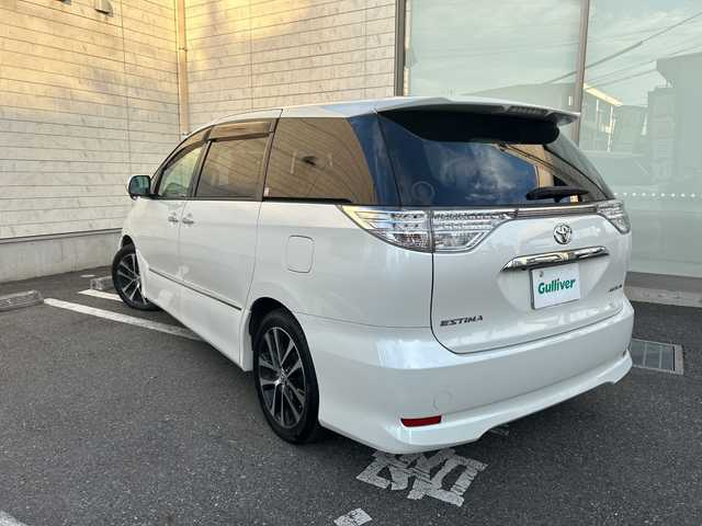 トヨタ エスティマ アエラス プレミアムエディション 埼玉県 2015(平27)年 12.6万km ホワイトパールクリスタルシャイン モデリスタエアロ/純正SD・T-Connect8インチナビ（NSZA-X64T）/　DTV/CD/DVD/BT/SD/SDREC/両側パワースライドドア/バックカメラ/ハーフレザーシート/純正フリップダウンモニター（V11T-R62C）/2列目オットマン/ウォークスルー/クルーズコントロール/TRC（トラクションコントロール）/ビルトインETC/エンジンスタートボタン/スマートキー/純正HIDヘッドライト/フォグランプ/オートライト/純正アルミホイール
