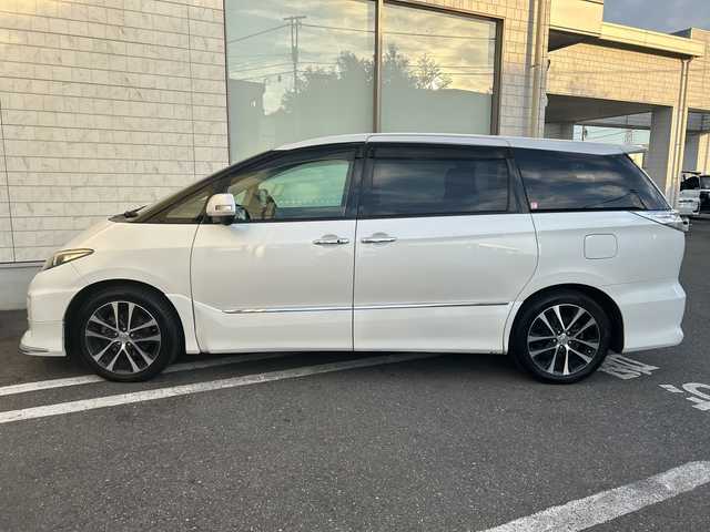 トヨタ エスティマ アエラス プレミアムエディション 埼玉県 2015(平27)年 12.6万km ホワイトパールクリスタルシャイン モデリスタエアロ/純正SD・T-Connect8インチナビ（NSZA-X64T）/　DTV/CD/DVD/BT/SD/SDREC/両側パワースライドドア/バックカメラ/ハーフレザーシート/純正フリップダウンモニター（V11T-R62C）/2列目オットマン/ウォークスルー/クルーズコントロール/TRC（トラクションコントロール）/ビルトインETC/エンジンスタートボタン/スマートキー/純正HIDヘッドライト/フォグランプ/オートライト/純正アルミホイール